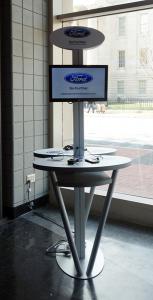 Cell Phone Charging Stations with Dual Monitors and Graphics at Auto Dealership -- Image 3