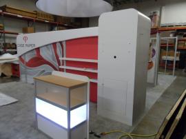 Custom eSmart with 10x10 Conversion.  Includes Large AERO Header, Storage Closet, Product Shelves, and Custom Base-lit Display Case -- Image 2