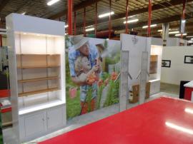 Custom eSmart (including 10x10 breakdown) with Backlit Counter, Custom Shelving, and Literature Stands -- Image 2