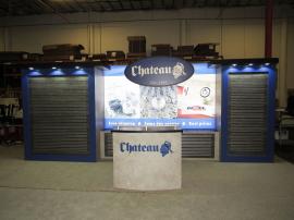 Custom Inline with Laminated Slatwall, Puck Lights, LED Lightbox with Fabric Graphic, Dimensional Sign, and Custom Reception Counter with Storage