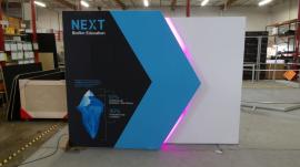 Custom Backlit Reconfigurable Inline Exhibit with Monitor Mount, SEG Fabric Graphics, and Custom Backlit Counter