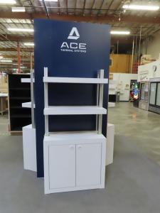 Custom Triangle Kiosk with Shelves, Locking Storage, and Graphics