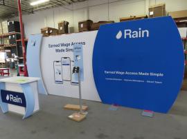 VK-6002 Modular Hybrid Exhibit with Fabric Graphics, Backlighting, MOD-1550 Reception Counter with Locking Storage, MOD-1369 iPad Stand with Graphics, and Monitor Mount