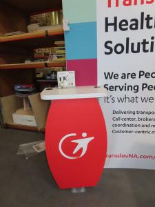 SYK-1014 Symphony Portable Display with SEG Fabric Graphic, Workstation with Wireless Charging Pad, SYM-408 Counter with Locking Storage, Monitor Mount, and LED Stem Lights -- View 2