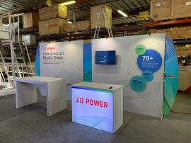 RENTAL: RE-2044 Design with (2) Backwall Graphic Sections at 7.5' Wide x 7.5' High, (4) LED Arm Lights, (1) Monitor Mount, (1) 32" Monitor, RE-1567 Backlit Reception Counter, RE-1578 Genius Bar, SEG Fabric Graphics, and Direct Print Sintra Accent Wings