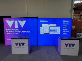 RE-2046 Inline Design with (2) Single-Sided Lightboxes at 114" Wide x 95" High, (2) RE-1202 Reception Counters with Black Laminated Tops, SEG Fabric Graphics, and Direct Print Sintra Graphics