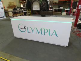 Modified MOD-1736 Counter (96" x 24" 38") with (2) Pop Up Power Grommets, RGB LED Accent Lights, Locking Storage, and Vinyl Graphic