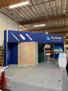 RENTAL: Island Design with L-Shaped Gravitee Panel System Backwall -- View 2