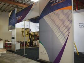 Engineered Aluminum Extrusion Island Exhibit with Silicone Edge Graphics (SEG) and Custom Counters -- Image 1